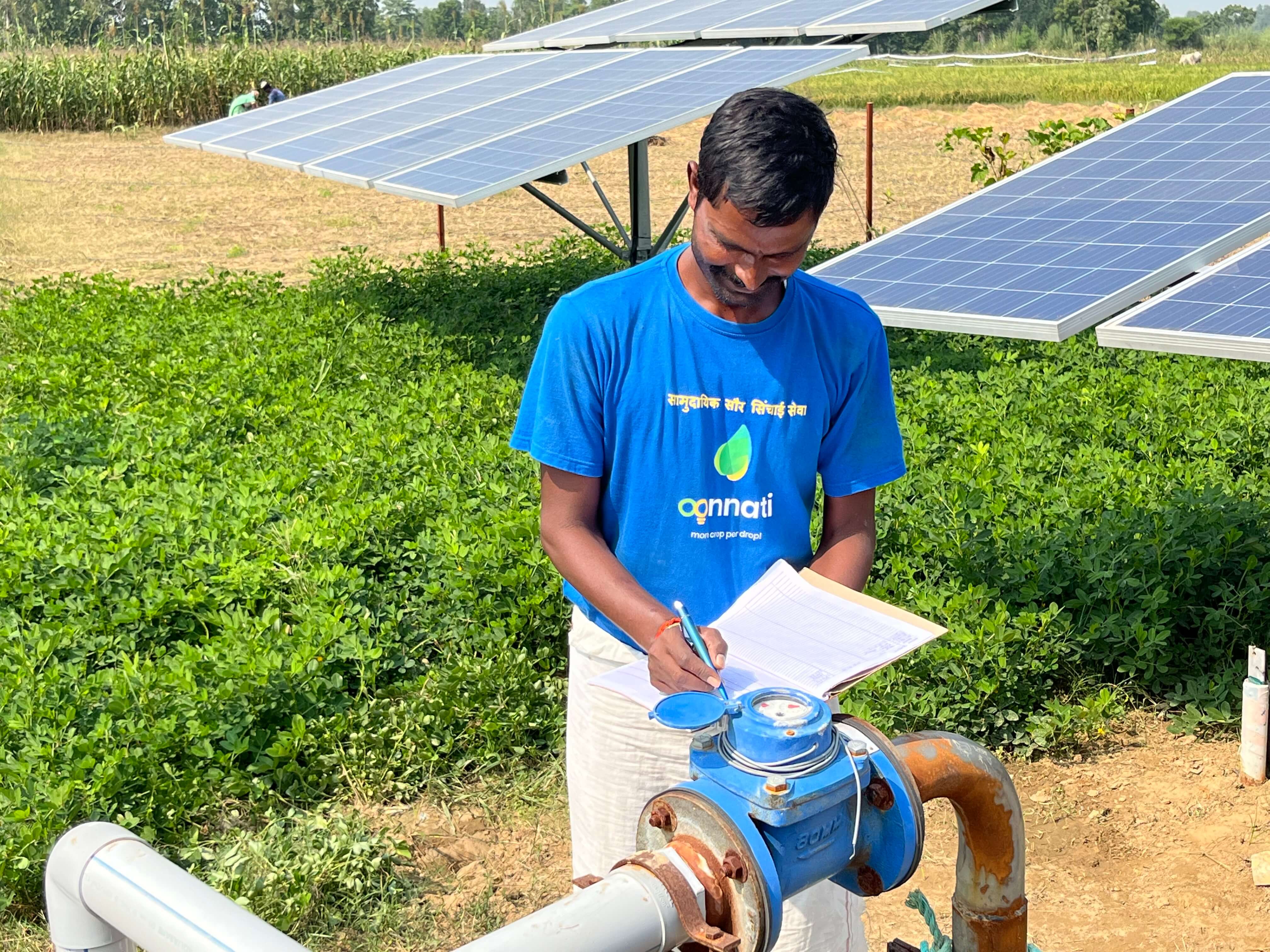 A solar pump operator at a solar Irrigation site. Operators are hired locally at the village level and trained to provide Pay-Per-Use services in their communities